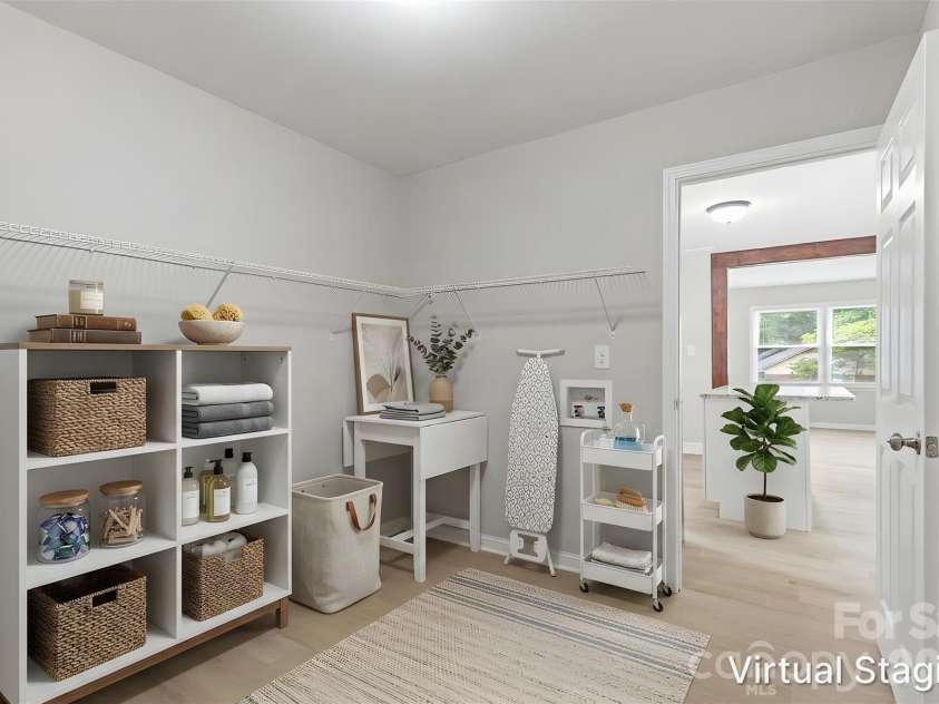 5233 Delivau Drive, Charlotte, NC 28215.  MLS# CAR4420867, YatesRealty ID 48592. Walking into the utility/laundry room attached to the kitchen (virtually staged & enhanced).
