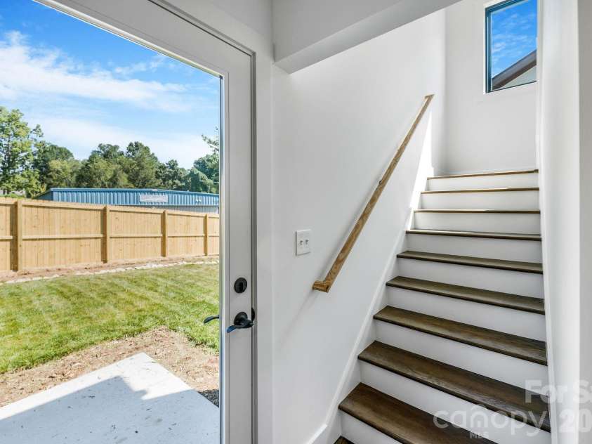 138 Shiloh Road, Asheville, NC 28803.  MLS# CAR4420583, YatesRealty ID 48599. Backyard Access Near Kitchen with Stairwell to Upper Level