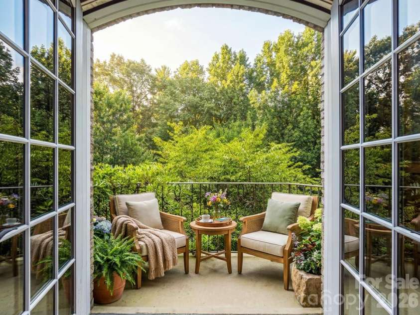 150 Rainbow View Drive, Fletcher, NC 28732.  MLS# CAR4399161, YatesRealty ID 486. Virtually Staged bedroom balcony overlooking estate