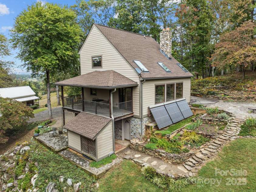 71 Kuykendall Branch, Asheville, NC 28804.  MLS# CAR4293308, YatesRealty ID 4860. Custom rock work, terrace and numerous perennial gardens