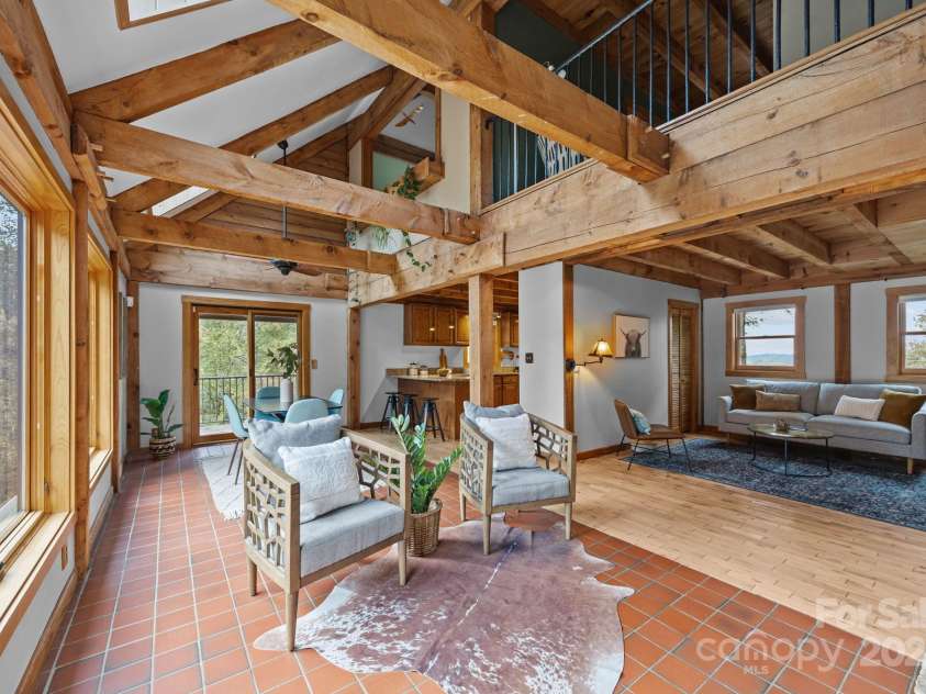 71 Kuykendall Branch, Asheville, NC 28804.  MLS# CAR4293308, YatesRealty ID 4860. Great room open to additional living room