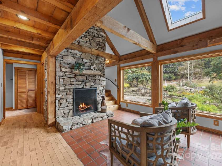 71 Kuykendall Branch, Asheville, NC 28804.  MLS# CAR4293308, YatesRealty ID 4860. Great room with heated flooring and wood burning fireplace