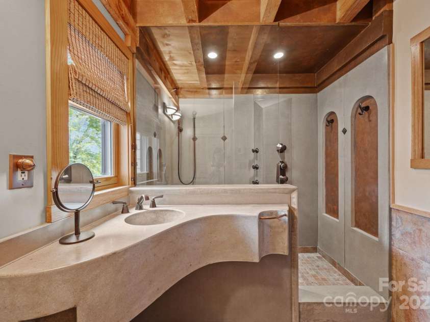 71 Kuykendall Branch, Asheville, NC 28804.  MLS# CAR4293308, YatesRealty ID 4860. Main floor bathroom all custom concrete