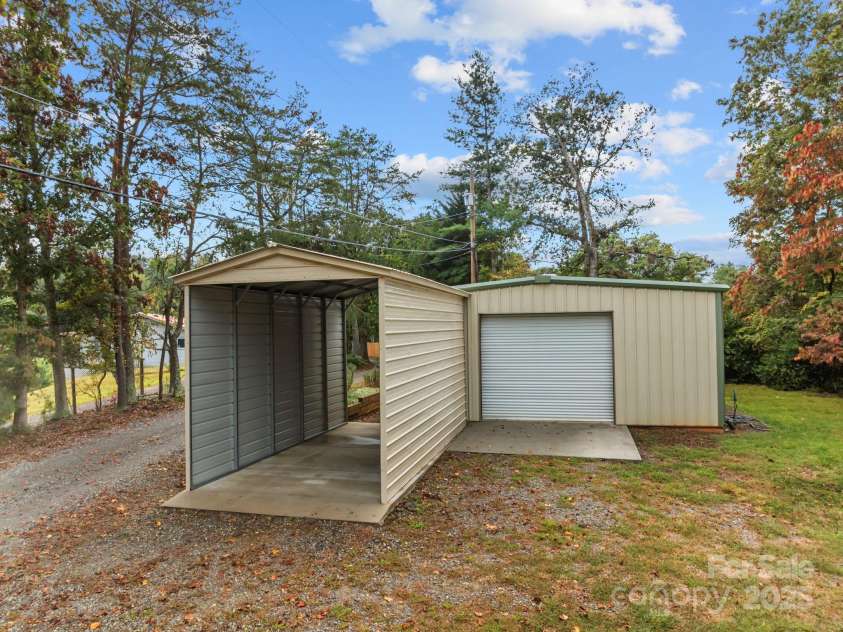 71 Kuykendall Branch, Asheville, NC 28804.  MLS# CAR4293308, YatesRealty ID 4860. Workshop and trailer or RV carport/storage