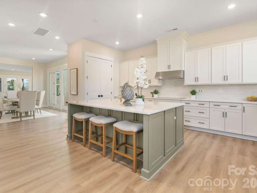 4531 Splash Trail, Sherrills Ford, NC 28673.  MLS# CAR4418307, YatesRealty ID 48603. Large kitchen island with bar seating and pantry