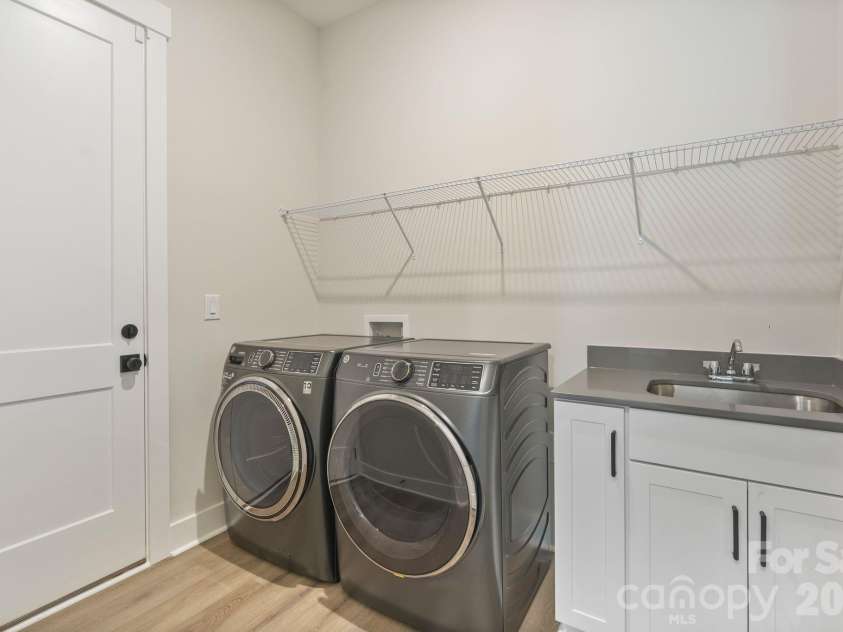 4531 Splash Trail, Sherrills Ford, NC 28673.  MLS# CAR4418307, YatesRealty ID 48603. Spacious laundry room includes washer, dryer, and utility sink