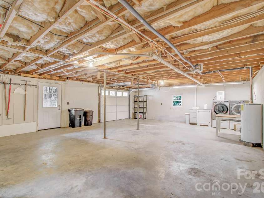 182 Ellerslie Acre None, Hendersonville, NC 28739.  MLS# CAR4385245, YatesRealty ID 48627. Garage/storage/laundry under second house