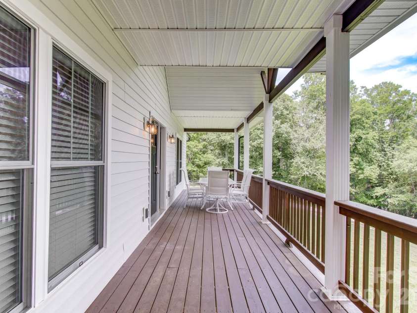 182 Ellerslie Acre None, Hendersonville, NC 28739.  MLS# CAR4385245, YatesRealty ID 48627. Large front porch on mainb house