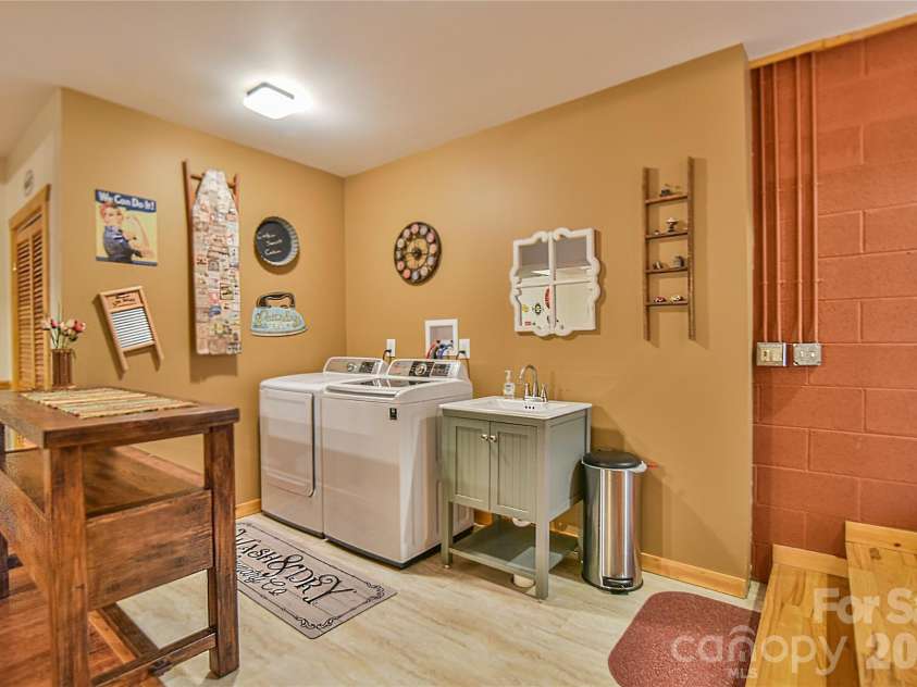 27 Winn Drive, Leicester, NC 28748.  MLS# CAR4419621, YatesRealty ID 48643. Sweet Laundry Area.