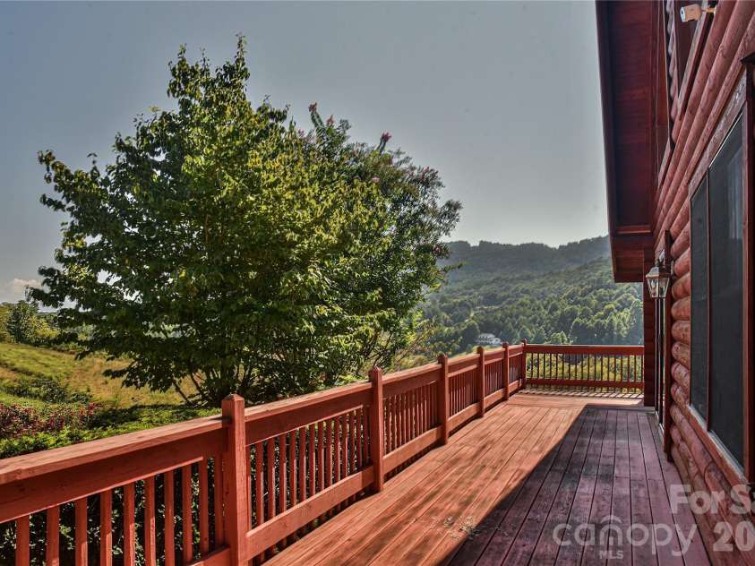 27 Winn Drive, Leicester, NC 28748.  MLS# CAR4419621, YatesRealty ID 48643. Wrap around porch.