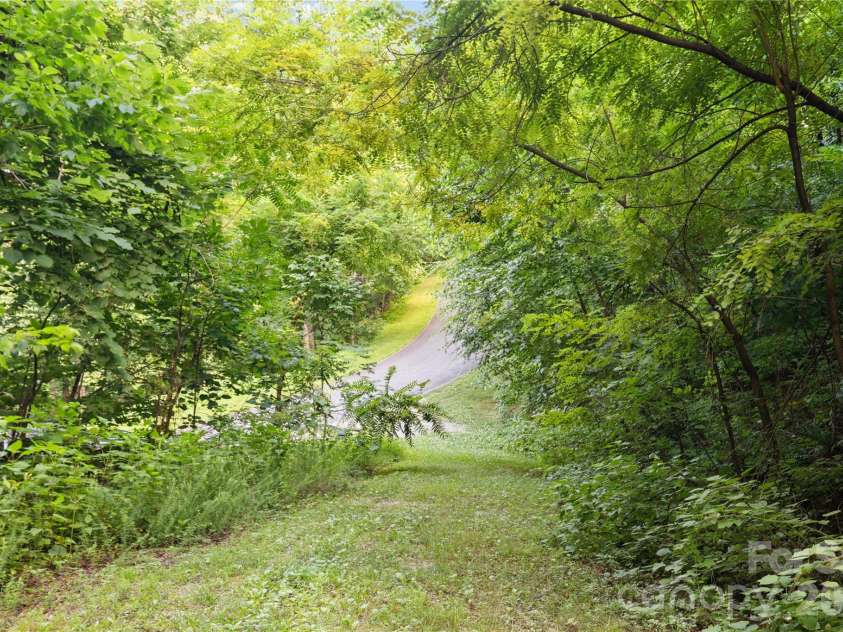 1915 Creston Drive, Black Mountain, NC 28711.  MLS# CAR4402197, YatesRealty ID 48644. Driveway looking at Creston Drive.