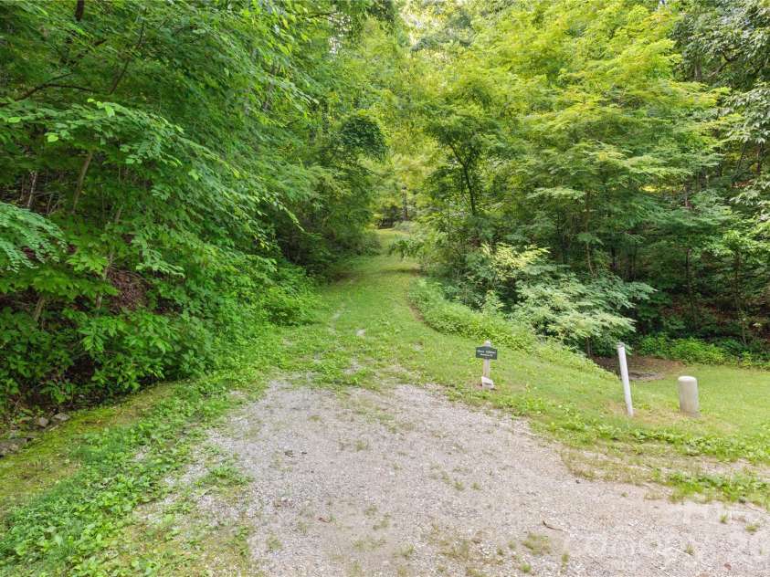 1915 Creston Drive, Black Mountain, NC 28711.  MLS# CAR4402197, YatesRealty ID 48644. Gravel rough-in driveway in place. Builder plans include paving.