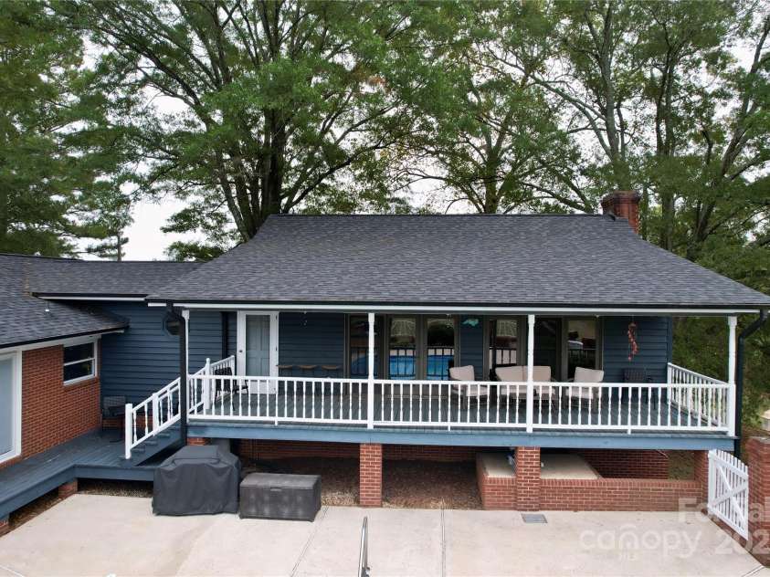 11720 Kluttz Road, Gold Hill, NC 28071.  MLS# CAR4310441, YatesRealty ID 4865. Covered porch with walk out from family room to pool surround.