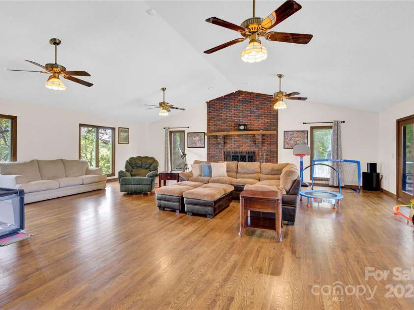 11720 Kluttz Road, Gold Hill, NC 28071.  MLS# CAR4310441, YatesRealty ID 4865. Oversized great room with fireplace