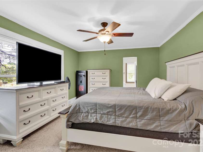 11720 Kluttz Road, Gold Hill, NC 28071.  MLS# CAR4310441, YatesRealty ID 4865. Primary bedroom with walk in closet, and en suite bathroom.  