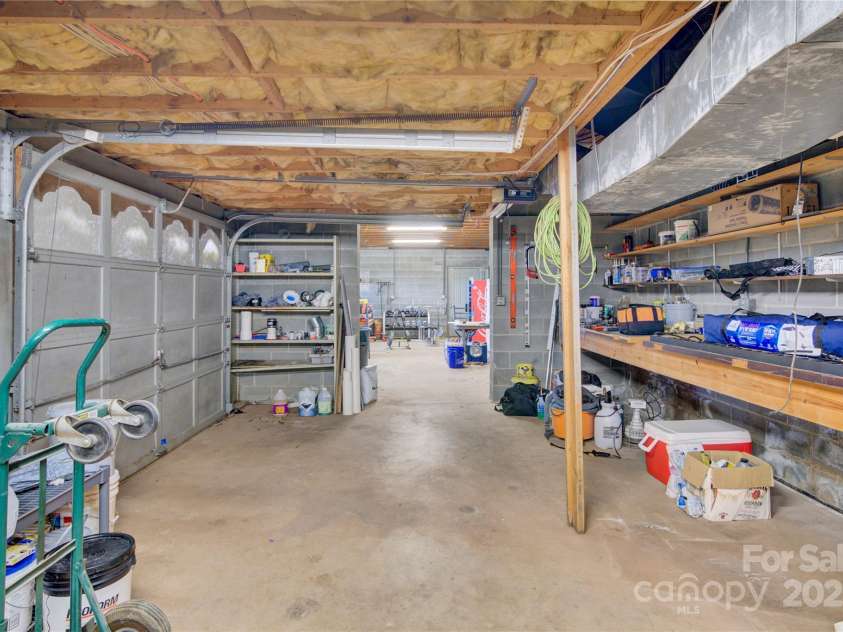 11720 Kluttz Road, Gold Hill, NC 28071.  MLS# CAR4310441, YatesRealty ID 4865. Third garage bay with workshop area