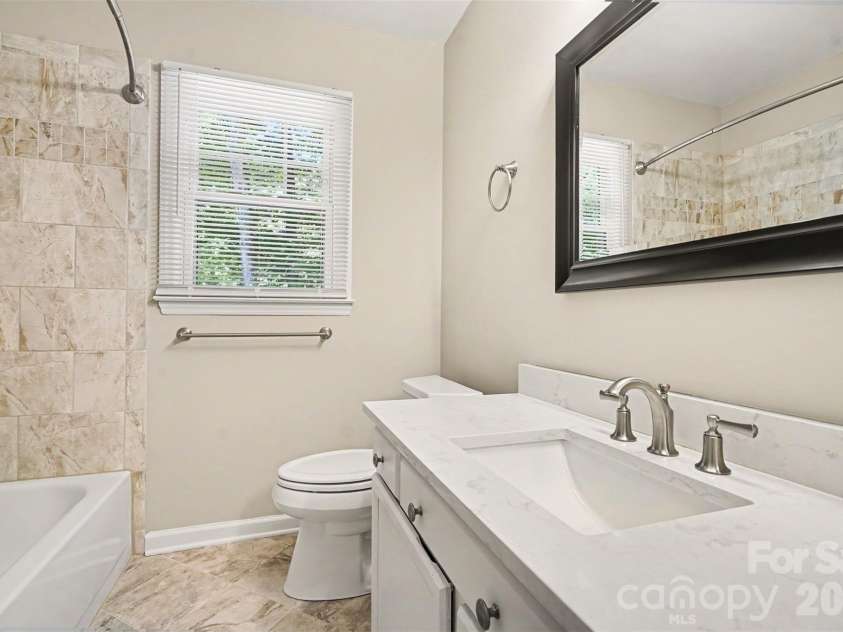 6443 High Creek Court, Charlotte, NC 28277.  MLS# CAR4420225, YatesRealty ID 48657. Bathroom features quartz counter and tile upgrades
