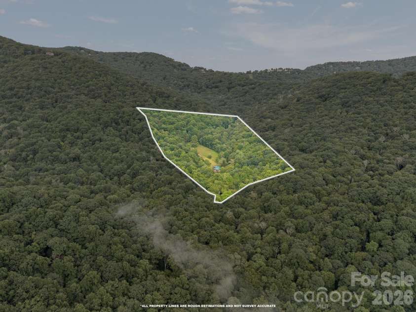 1061 Indian Trail Road, Mars Hill, NC 28754.  MLS# CAR4417141, YatesRealty ID 48665. Property surrounded by Pisgah National Forest