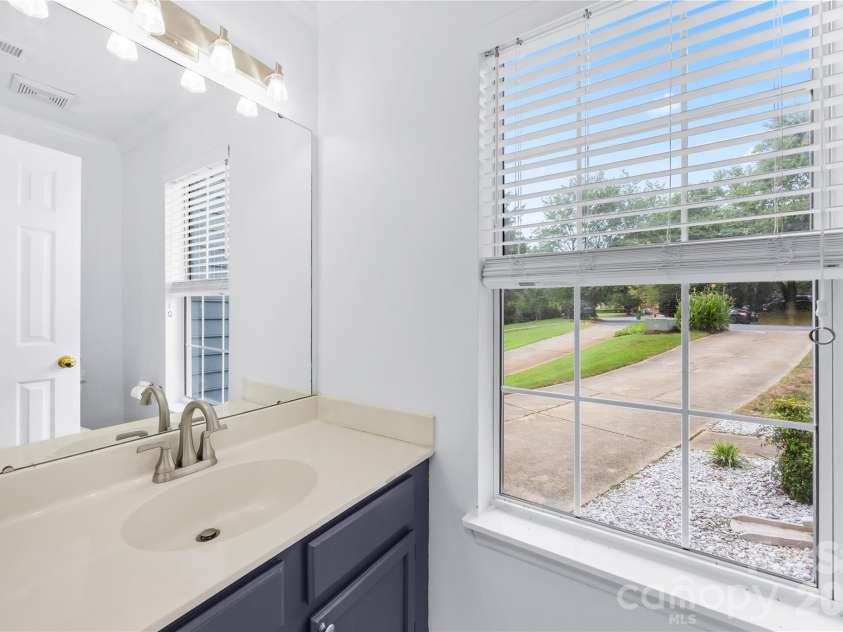 1112 Coachlight Circle, Charlotte, NC 28262.  MLS# CAR4420288, YatesRealty ID 48667. Half bath on main floor to keep privacy upstairs.