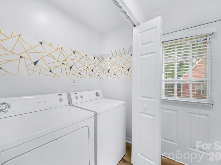 1112 Coachlight Circle, Charlotte, NC 28262.  MLS# CAR4420288, YatesRealty ID 48667. Laundry on main floor with washer/dryer included.