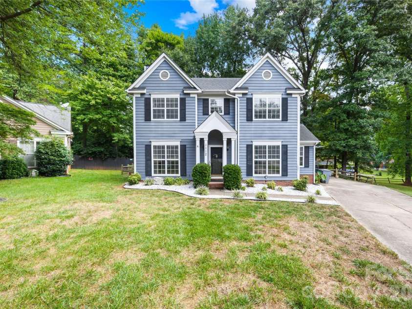 1112 Coachlight Circle, Charlotte, NC 28262.  MLS# CAR4420288, YatesRealty ID 48667. Situated on a quiet cul-de-sac, this charming Colonial-style home offers inviting curb appeal, a welcoming entrance, and a spacious front yard.