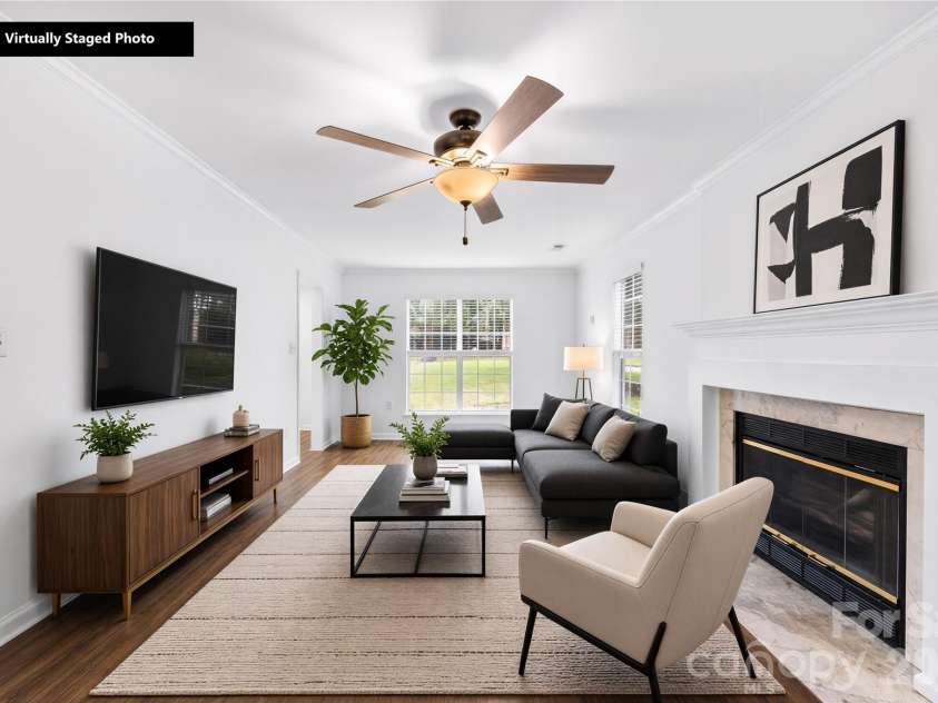 1112 Coachlight Circle, Charlotte, NC 28262.  MLS# CAR4420288, YatesRealty ID 48667. Virtually staged living room.