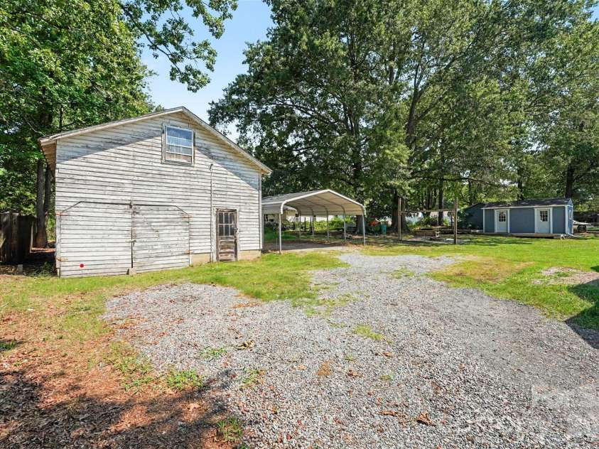 1911 Central Drive, Kannapolis, NC 28083.  MLS# CAR4420924, YatesRealty ID 48678. Large shed/workshop. Wired, has upstairs for storage. Needs some TLC on the outside!