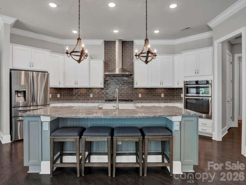 15956 Reynolds Drive, Indian Land, SC 29707.  MLS# CAR4416338, YatesRealty ID 48699. Open Kitchen with perfect setup large island, gas range, beautiful granite counters