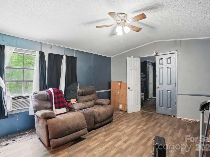 10420 Silver Mine Road, Indian Land, SC 29707.  MLS# CAR4251908, YatesRealty ID 4870. Interior view of Living Room to reference condition