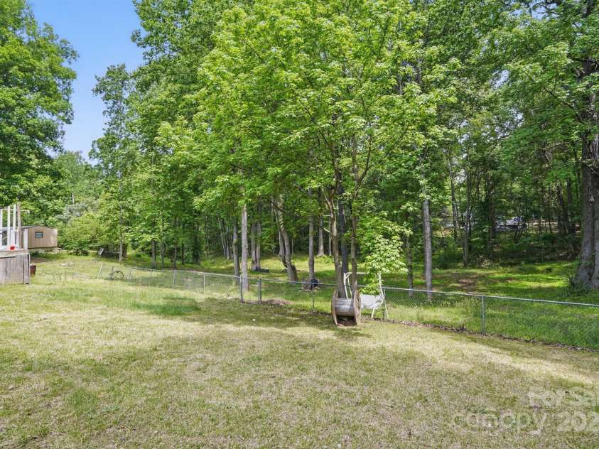 10420 Silver Mine Road, Indian Land, SC 29707.  MLS# CAR4251908, YatesRealty ID 4870. Tree lined to the rear of subjects lot