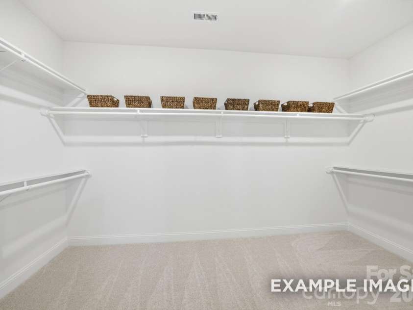2921 Audubon Ridge Drive, Belmont, NC 28012.  MLS# CAR4421026, YatesRealty ID 48703. Sample owner's suite walk in closet