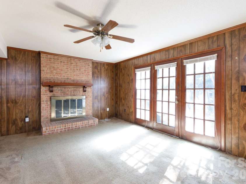 6323 Chalyce Lane, Charlotte, NC 28270.  MLS# CAR4418744, YatesRealty ID 48709. Den w Fireplace