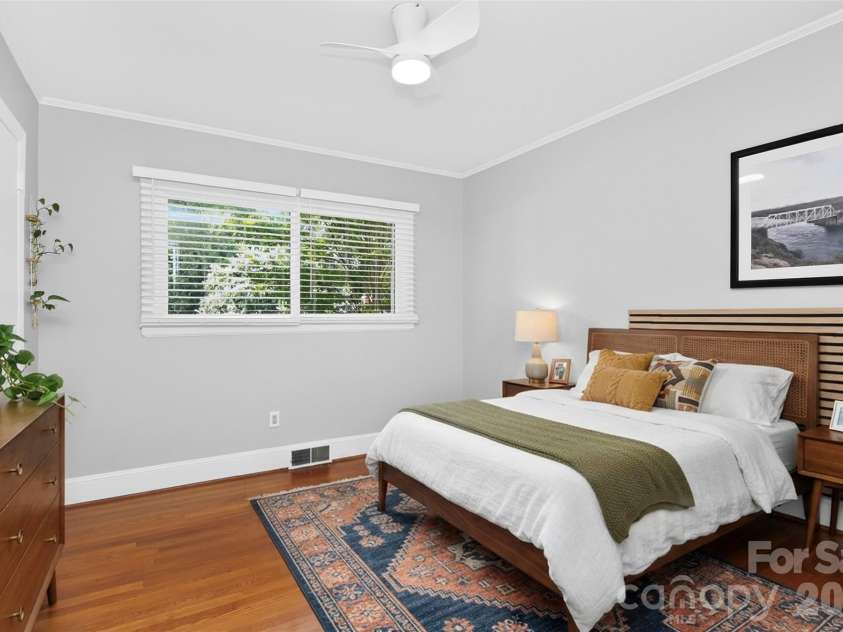 831 Faircrest Drive, Charlotte, NC 28210.  MLS# CAR4421440, YatesRealty ID 48734. Guest Bedroom virtually staged, slat headboard mounted on wall conveys