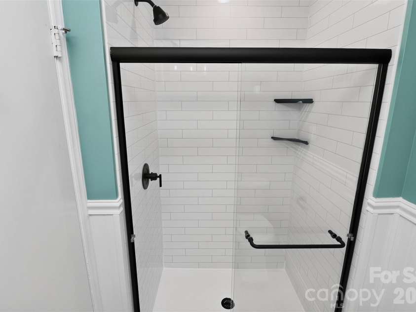 831 Faircrest Drive, Charlotte, NC 28210.  MLS# CAR4421440, YatesRealty ID 48734. Hall Bath shower
