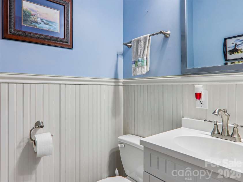 16 Hobe Crest, Hendersonville, NC 28792.  MLS# CAR4420313, YatesRealty ID 48745. Half bath with wainscoting.