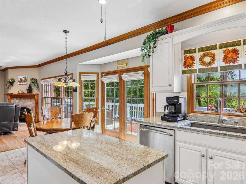 16 Hobe Crest, Hendersonville, NC 28792.  MLS# CAR4420313, YatesRealty ID 48745. Kitchen over looks the back deck and the views.