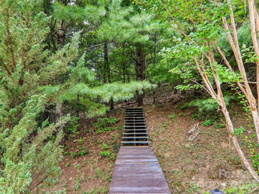 16 Hobe Crest, Hendersonville, NC 28792.  MLS# CAR4420313, YatesRealty ID 48745. Path to explore nature from the home.