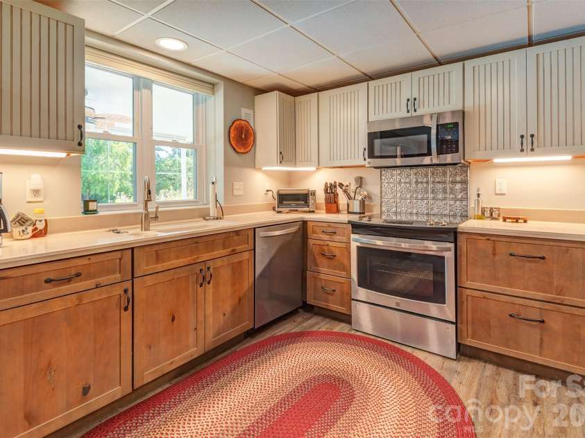 64 Greenridge Road, Weaverville, NC 28787.  MLS# CAR4420101, YatesRealty ID 48748. Lower level furnished apartment