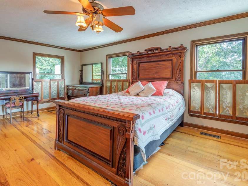 64 Greenridge Road, Weaverville, NC 28787.  MLS# CAR4420101, YatesRealty ID 48748. Primary bedroom suite with gas fireplace