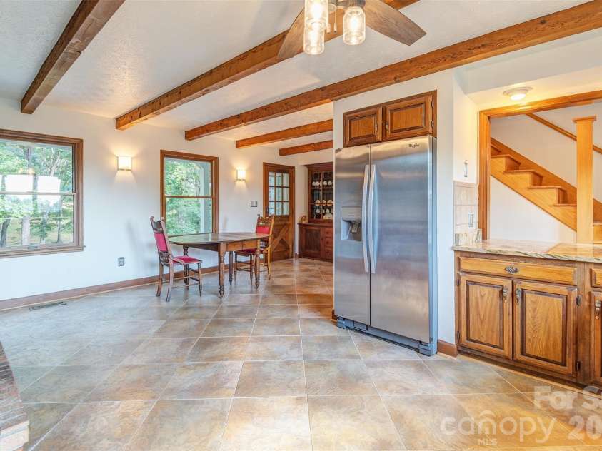 64 Greenridge Road, Weaverville, NC 28787.  MLS# CAR4420101, YatesRealty ID 48748. Second set of stairs return to the kitchen