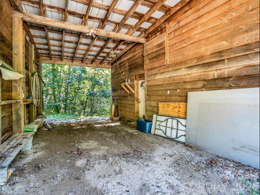 557 Sutton Mountain Ridge, Pisgah Forest, NC 28768.  MLS# CAR4419858, YatesRealty ID 48759. Large Equipment Storage in Barn