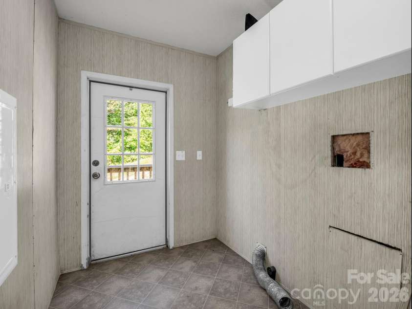 557 Sutton Mountain Ridge, Pisgah Forest, NC 28768.  MLS# CAR4419858, YatesRealty ID 48759. Laundry Room