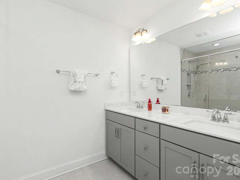 10307 Glenmere Creek Circle, Charlotte, NC 28262.  MLS# CAR4420962, YatesRealty ID 48765. Double vanity primary bathroom