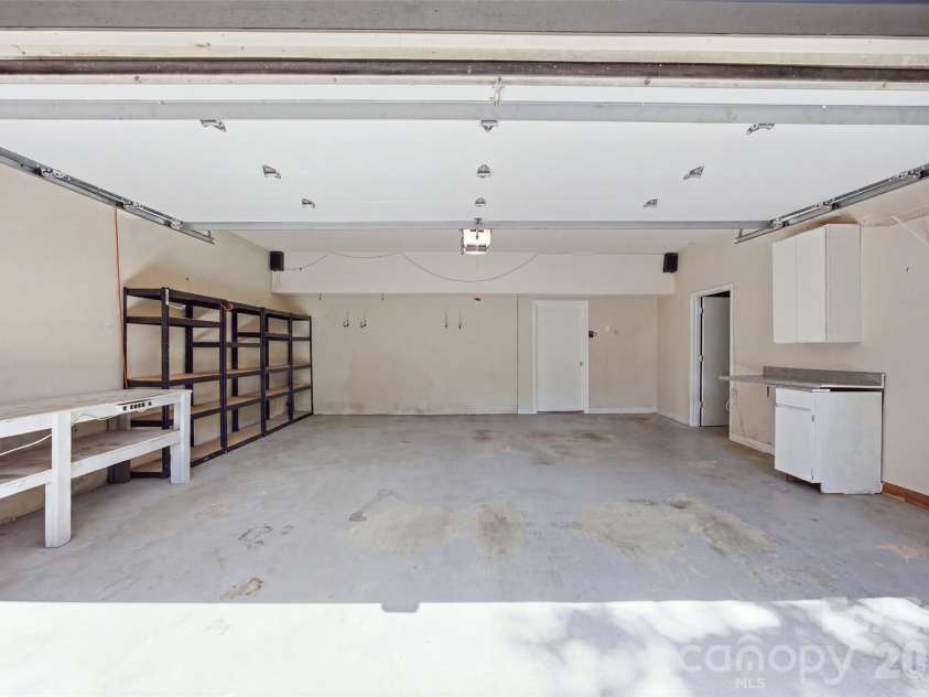 13432 Windward Cove, Charlotte, NC 28278.  MLS# CAR4419903, YatesRealty ID 48766. 2 Car Storage with Shelving & Storage Room