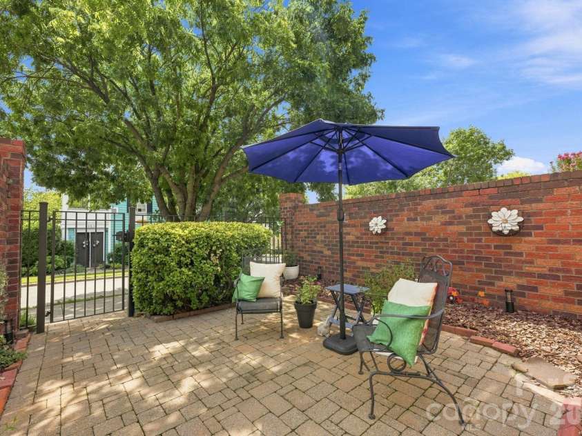 5962 Village Drive, Concord, NC 28027.  MLS# CAR4417673, YatesRealty ID 48771. Courtyard patio