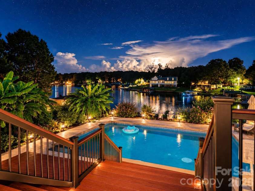 745 Anchor Road, Norwood, NC 28128.  MLS# CAR4419200, YatesRealty ID 48776. Night Time Waterview over the Pool