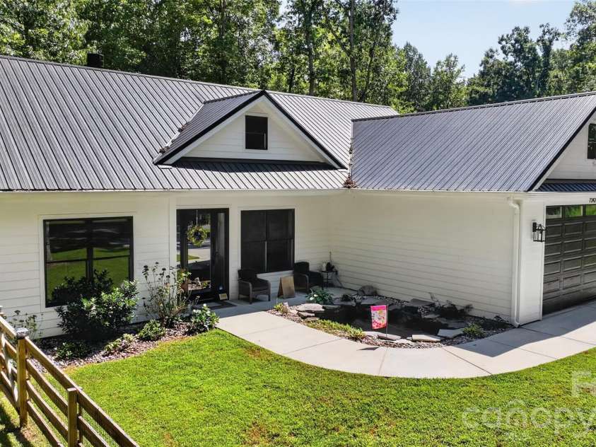 7342 Milan Drive, Huntersville, NC 28078.  MLS# CAR4418830, YatesRealty ID 48780. Front Entry w/Koi Pond