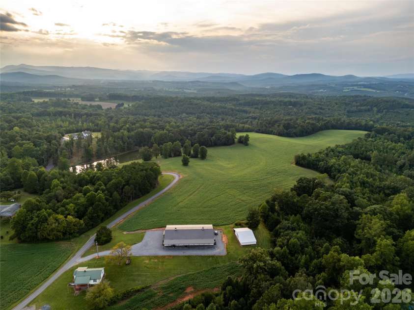 4013 NC Hwy 18 Highway, Vale, NC 28090.  MLS# CAR4417782, YatesRealty ID 48781. Barndo-Side View and Ag Fields