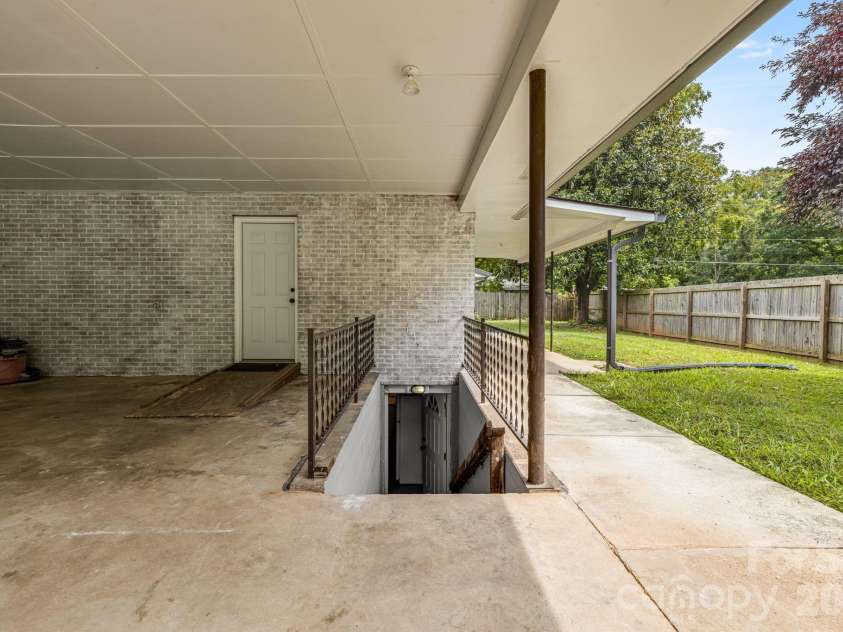 25 Hickory Tree Road, Asheville, NC 28805.  MLS# CAR4418920, YatesRealty ID 48783. Basement entrance
