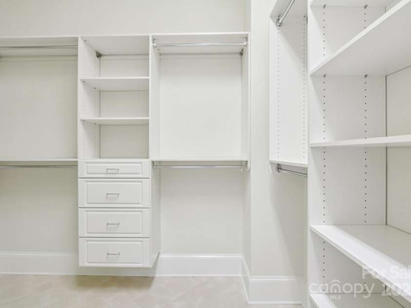 1322 Shinnecock Lane, Fort Mill, SC 29707.  MLS# CAR4239031, YatesRealty ID 4879. 1 of the spacious walk in closets off the primary bedroom.